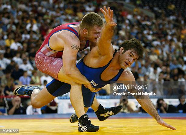 Garrett Lowney throws Justin Ruiz en route to Lowney's victory in the Greco Roman 96KG Final Match 2 during the 2004 Olympic Team Trials of Wrestling...