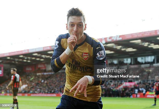 Mesut Oezil celebrates scoring the first Arsenal goal during the Barclays Premier League match between AFC Bournemouth and Arsenal at The Vitality...