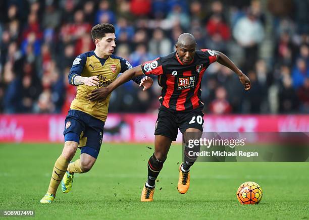 Benik Afobe of Bournemouth battles with Hector Bellerin of Arsenal during the Barclays Premier League match between A.F.C. Bournemouth and Arsenal at...