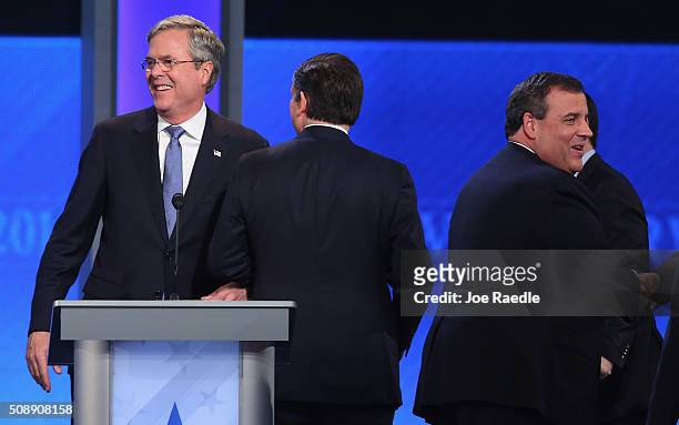 Republican presidential candidate Jeb Bush, Sen. Ted Cruz and New Jersey Governor Chris Christie visit at the conclusion of the Republican...