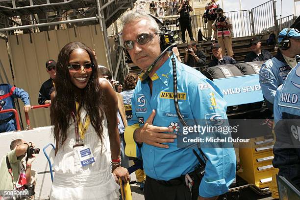 Supermodel, Naomi Campbell and her ex-boyfriend, Flavio Briatore talk in the pit lane at the Formula One Monaco Grand Prix on May 23 in Monte Carlo,...