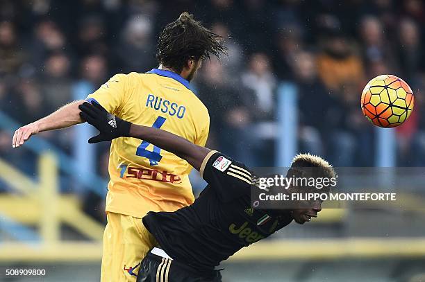 Juventus' midfielder from France Paul Pogba fights for the ball with Frosinone's defender from Italy Adriano Russo during the Italian Serie A...