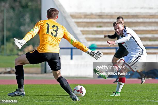 Nicholas Hayes of England challenges Manuel Wintzheimer of Germany during the UEFA Under17 match between U17 England v U17 Germany on February 7,...