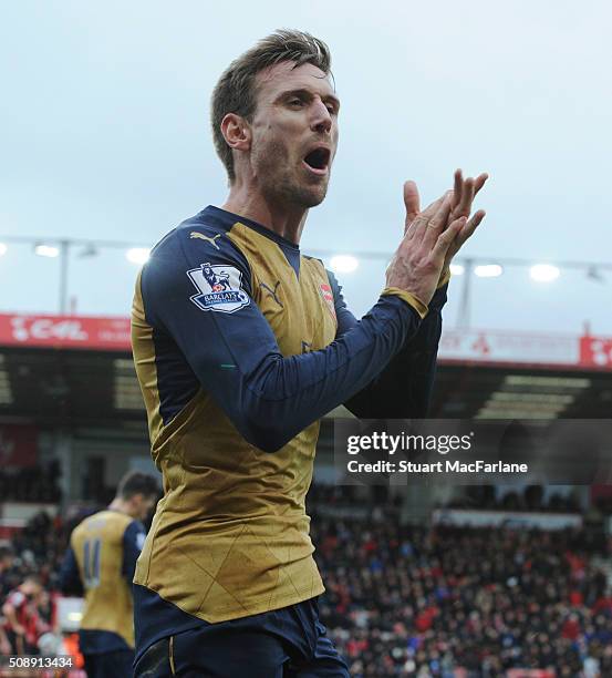 Arsenal's Nacho Monreal celebrates at the final whistle after the Barclays Premier League match between AFC Bournemouth and Arsenal at The Vitality...