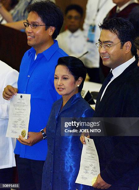 President Gloria Arroyo joins her winning Senatorial candidates Manuel Roxas and Ramon Revilla following their official proclamation by the...