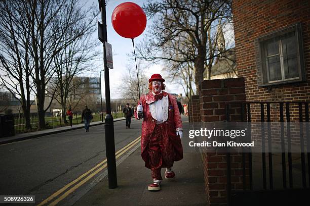 Clowns arrive ahead of the 70th anniversary Clown Church Service at All Saints Church in Haggerston on February 7, 2016 in London, England. Clowns...