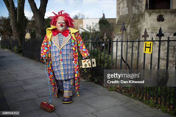 Clowns arrive ahead of the 70th anniversary Clown Church Service at All Saints Church in Haggerston on February 7, 2016 in London, England. Clowns...