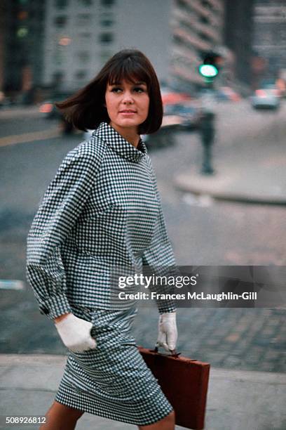 Feminist author Gloria Steinem wearing overblouse and matching skirt by Sloat.