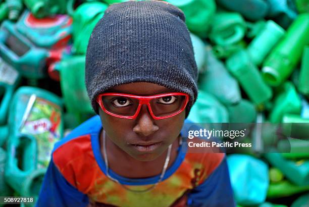 Migrant boy who works for a living in Jaflong. Young boys usually work at stone quarry or any other works available to sustain their living in Sylhet.