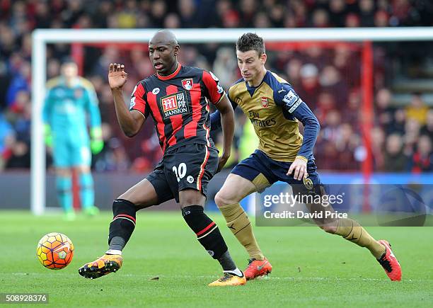 Laurent Koscielny of Arsenal marks Benik Afobe of Bournemouth during the Barclays Premier League match between AFC Bournemouth and Arsenal at The...