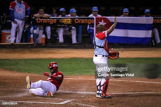 Yunieski Betancourt of Ciego de Avila slides to reach base during a semifinal match between Ciego de Avila from Cuba and Venados de Mazatlán from...