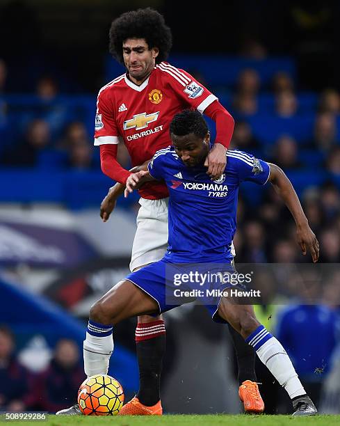 Marouane Fellaini of Manchester United tackles John Mikel Obi of Chelsea during the Barclays Premier League match between Chelsea and Manchester...