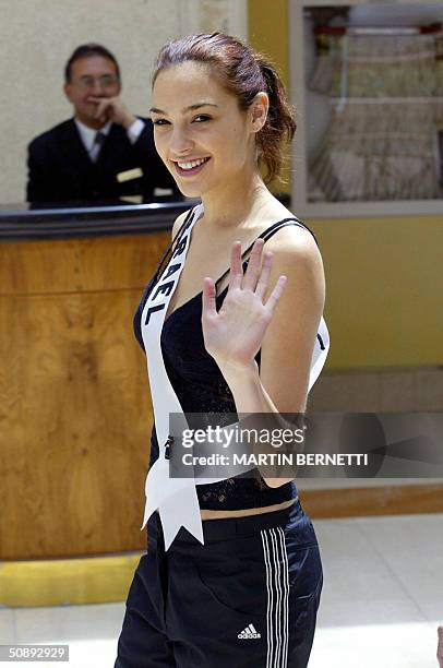 Miss Israel Gal Gadot waves at photographers as she walks in the hotel hall in Quito, Ecuador, 24 May 2004, where the Miss Universe 2004 contest will...