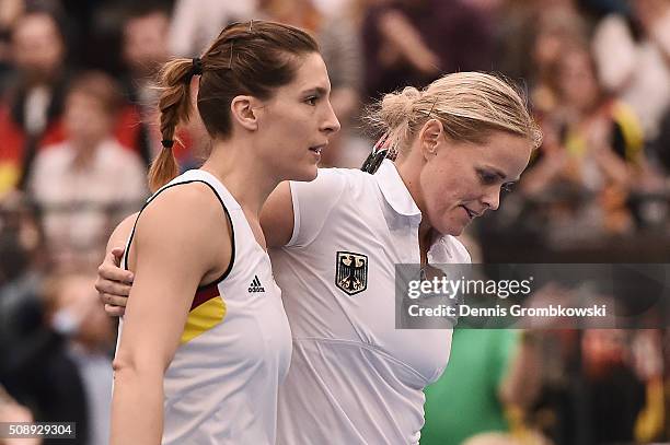 Andrea Petkovic and Anna-Lena Groenefeld of Germany look dejected in their double match against Martina Hingis and Belinda Bencic of Switzerland on...