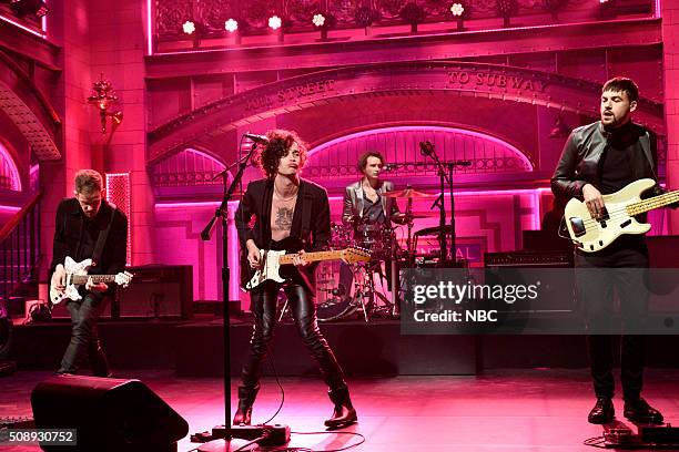 Larry David" Episode 1695 -- Pictured: Adam Hann, Matthew Healy, Ross MacDonald, and George Daniel of musical guest The 1975 perform on February 6,...