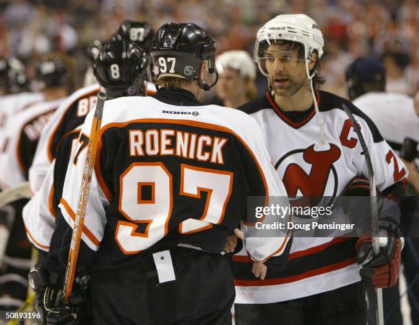 Center Jeremy Roenick of the Philadelphia Flyers shakes hands with defenseman Scott Niedermayer of the New Jersey Devils during game five of the...