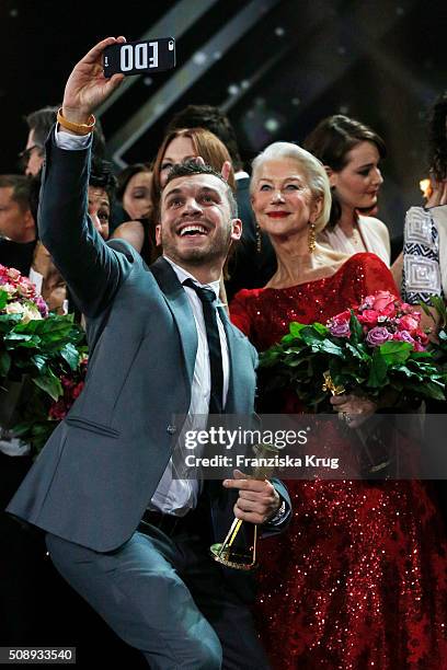 Edin Hasanovic and Helen Mirren attend the Goldene Kamera 2016 show on February 6, 2016 in Hamburg, Germany.