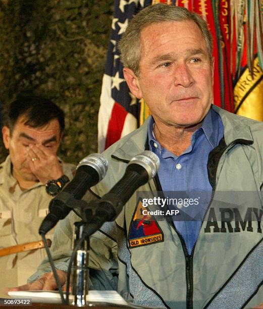 : This 27 November 2003 file photo shows US President George W. Bush, accompanied by commander of the US forces in Iraq Lt. Gen. Ricardo Sanchez ,...