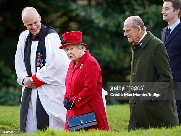 Queen Elizabeth II and Prince Philip, Duke of Edinburgh accompanied by the Reverend Jonathan Riviere depart after attending Sunday service at the...
