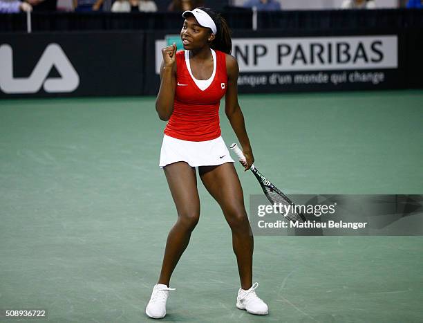 Francoise Abanda of Canada reacts after defeating Olga Govortsova of Belarus during their Fed Cup BNP Paribas match at Laval University in Quebec...