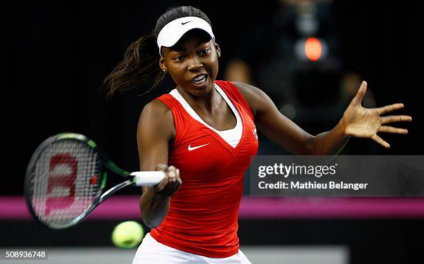 Francoise Abanda of Canada returns a shot to Olga Govortsova of Belarus during their Fed Cup BNP Paribas match at Laval University in Quebec City on...