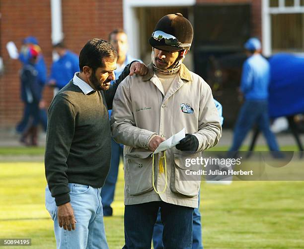 Sheikh Mohammed chats to trainer Saeed Bin Suroor after Godolphin trained horses returned to their stables after early morning gallops, on May 25,...