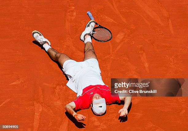 Fabrice Santoro of France celebrates after winning the longest ever match in tennis history in his first round match against Arnaud Clement of France...