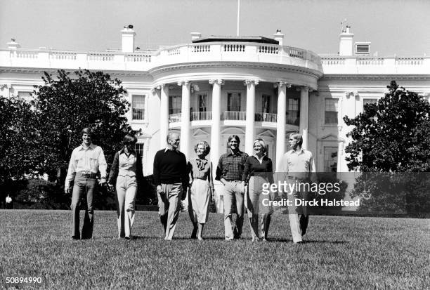 Portrait of the Ford family as they walk across the White House lawn, Washington DC, September 6, 1976. Left to right, son Michael and his wife Gayle...