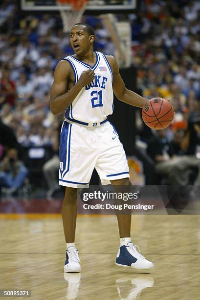 Chris Duhon of the Duke Blue Devils moves the ball against the University of Connecticut Huskies during the semifinal game of the NCAA Final Four...