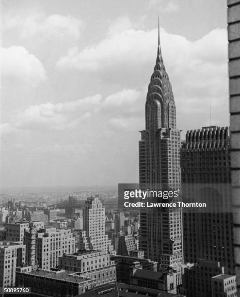 Aerial view of the Chrysler Building, in Midtown Manhattan, with the Chanin Building, visible on the left, New York, mid 20th Century.