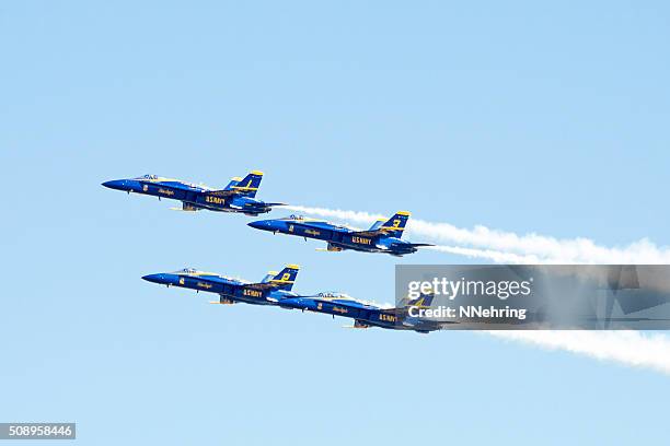 blue angels flying in clear blue sky - blue angels stock pictures, royalty-free photos & images