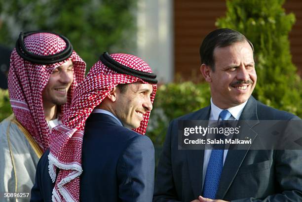 Jordanian Crown Prince Hamzah Bin al-Hussein is surrounded by his brothers Prince Faisal Bin al-Hussein and Prince Hashem Bin al-Hussein May 25, 2004...