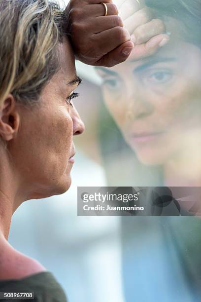pensive woman - social exclusion stock pictures, royalty-free photos & images