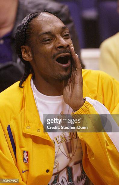 Rapper Snoop Dogg watches the Minnesota Timberwolves take on the Los Angeles Lakers in Game 3 of the Western Conference Finals during the 2004 NBA...