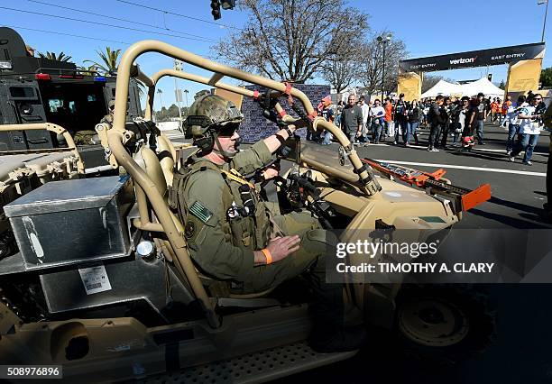 Security officers watch as Fans arrive for Super Bowl 50 at Levi's Stadium February 7, 2016 before the Denver Broncos take on the Carolina Panthers...