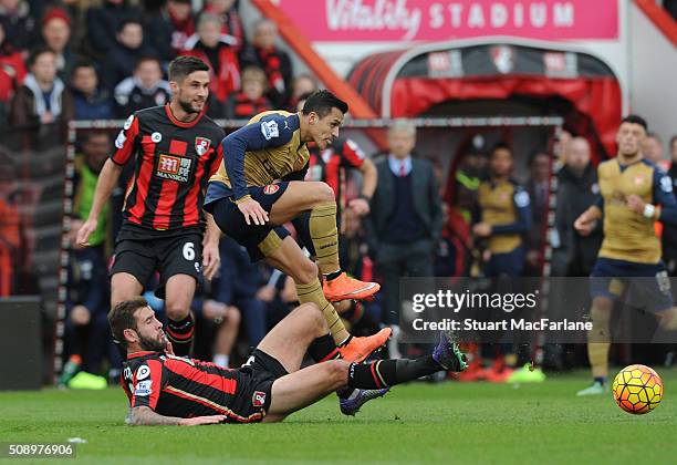 Alexis Sanchez of Arsenal challenged by Steve Cook of Bournemouth during the Barclays Premier League match between AFC Bournemouth and Arsenal at The...