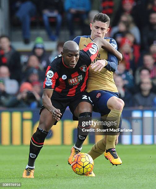 Benik Afobe of Bournemouth challenged by Gabriel of Arsenal during the Barclays Premier League match between AFC Bournemouth and Arsenal at The...
