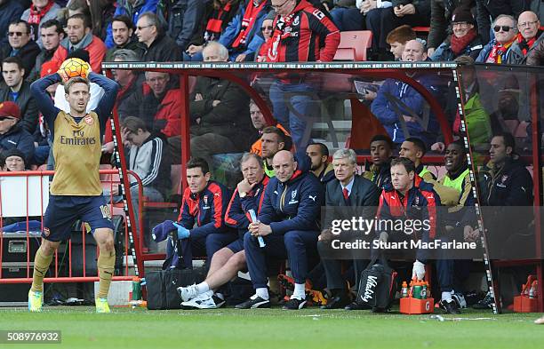 Arsenal manager Arsene Wenger with doctor Gary O'Driscoll, kit manager Vic Akers assistant Steve Bould and physio Colin Lewin during the Barclays...