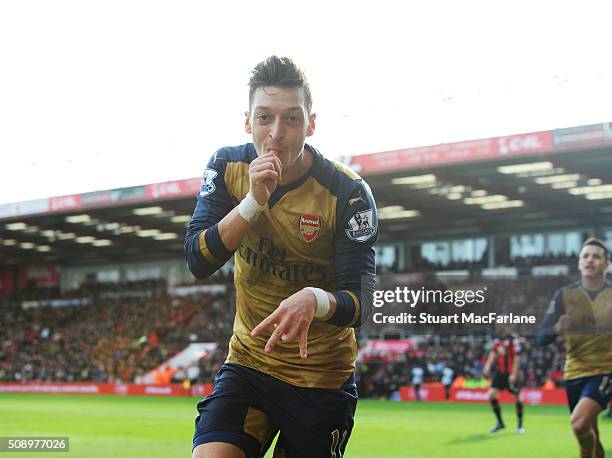 Mesut Ozil celebrates scoring the 1st Arsenal goal during the Barclays Premier League match between AFC Bournemouth and Arsenal at The Vitality...
