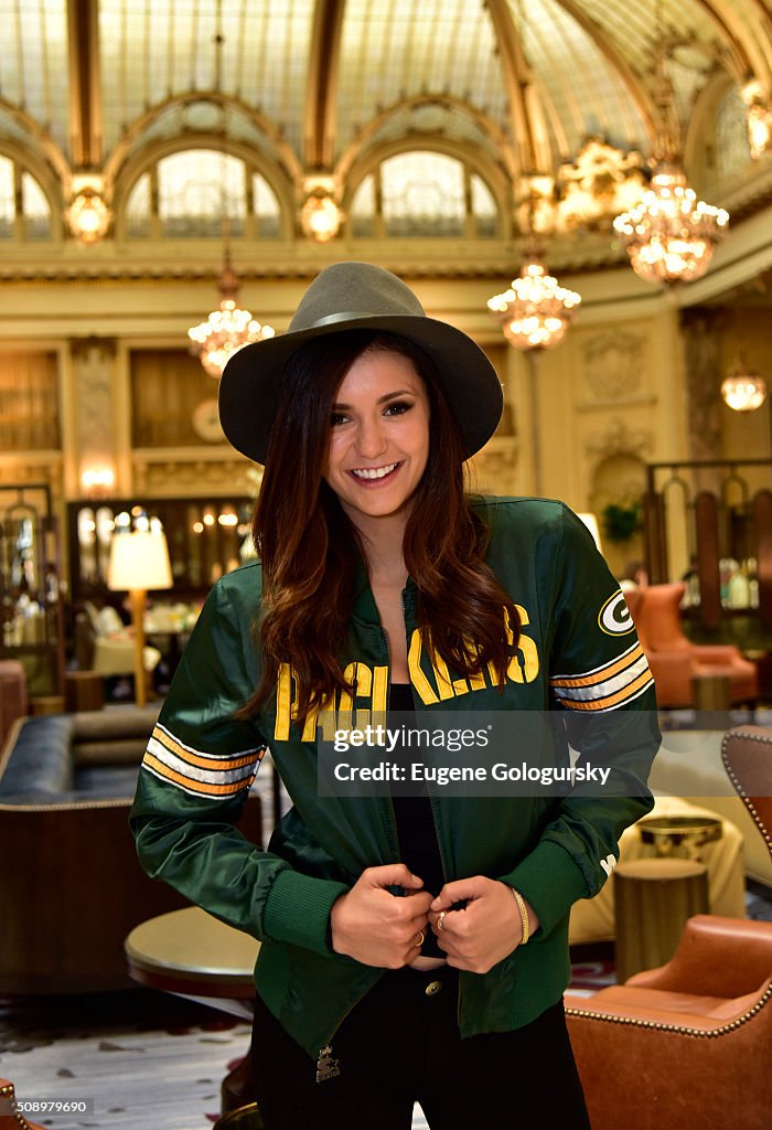 Nina Dobrev Wears Starter Jacket As She Heads To The Big Game