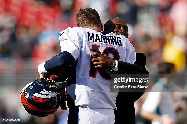 Former NFL player Marvin Harrison speaks to Peyton Manning of the Denver Broncos before Super Bowl 50 against the Carolina Panthers at Levi's Stadium...