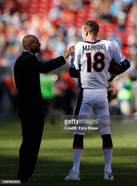 Former NFL player Marvin Harrison speaks to Peyton Manning of the Denver Broncos before Super Bowl 50 against the Carolina Panthers at Levi's Stadium...