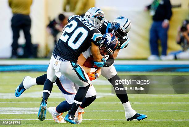 Owen Daniels of the Denver Broncos is tackled by Kurt Coleman of the Carolina Panthers in the first quarter during Super Bowl 50 at Levi's Stadium on...