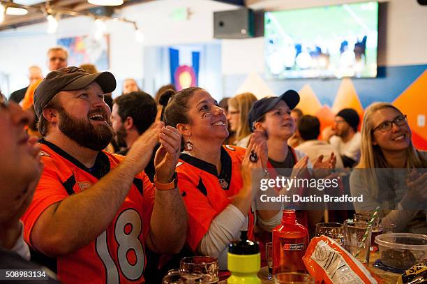 Denver Broncos fans watch Super Bowl 50 at Declaration Brewing Company on February 7, 2016 in Denver, Colorado.