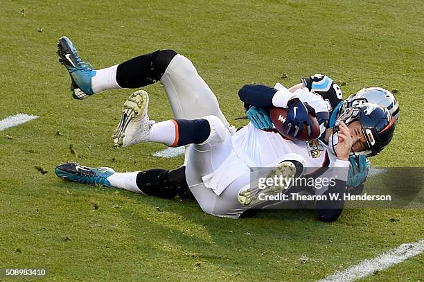 Luke Kuechly of the Carolina Panthers sacks Peyton Manning of the Denver Broncos during the first quarter of Super Bowl 50 at Levi's Stadium on...