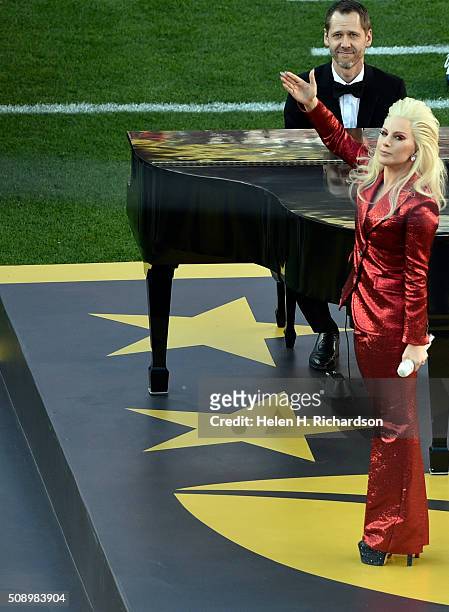 Lady Gaga waves to the crowd after singing the National Anthem. The Denver Broncos played the Carolina Panthers in Super Bowl 50 at Levi's Stadium in...