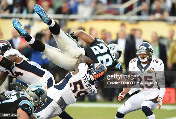 Carolina Panther Jonathan Stewart jumps into the end zone for a touchdown during Super Bowl 50 against the Denver Broncos at Levi's Stadium in Santa...