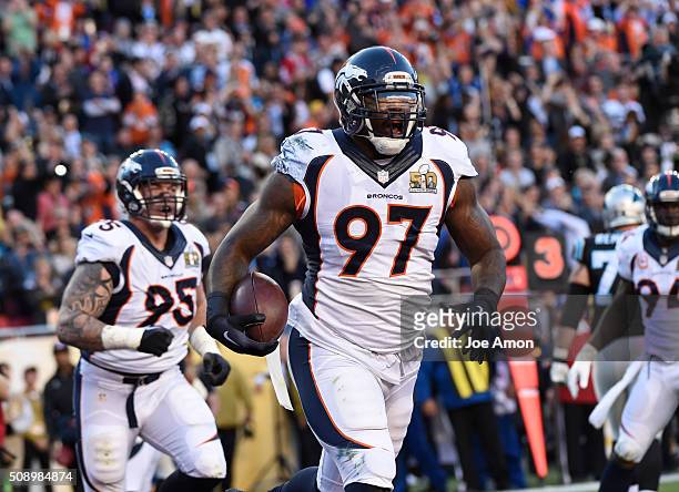 Malik Jackson of the Denver Broncos celebrates his touchdown after recovering a fumble in the first quarter. The Denver Broncos played the Carolina...