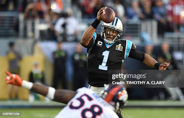 Carolina Panther quarterback Cam Newton passes under pressure from Von Miller of the Denver Broncos during Super Bowl 50 at Levi's Stadium in Santa...
