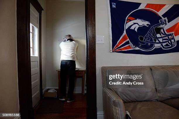 February 07: Denver Broncos fanatic Paul Ramsey paces then collects himself while watching Super Bowl 50 against the Carolina Panthers February 07,...